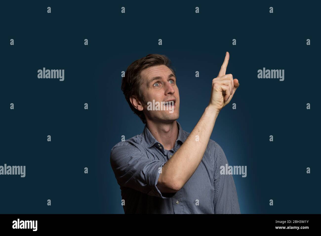Old man pointing mouth hi-res stock photography and images - Alamy
