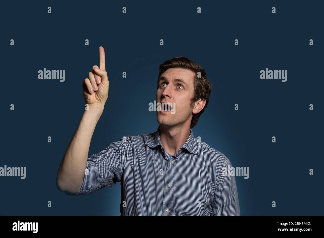 Old man pointing mouth hi-res stock photography and images - Alamy