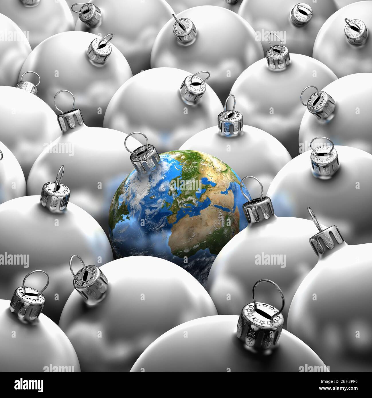 Christmas bauble earth globe planet amongst plain silver baubles, balls. Stock Photo