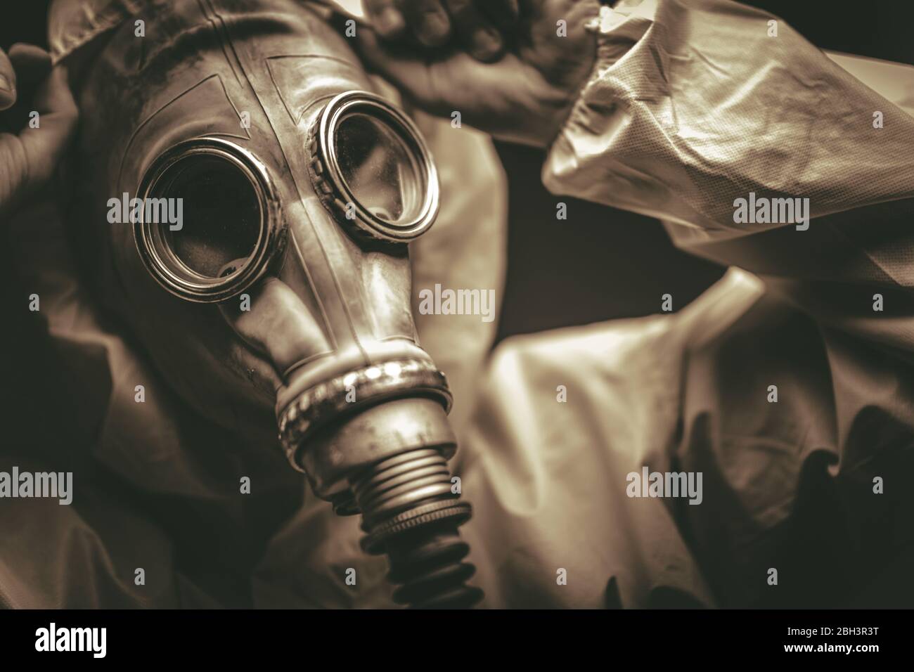 Close-Up Of Male In Full Hazmat Suit Protectiver Gear And Gas Mask. Stock Photo