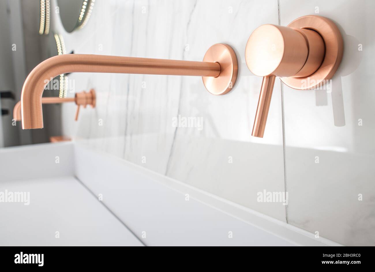 White Porcelain Sink With Copper Faucet, Knob, And Soap Dispenser. Stock Photo