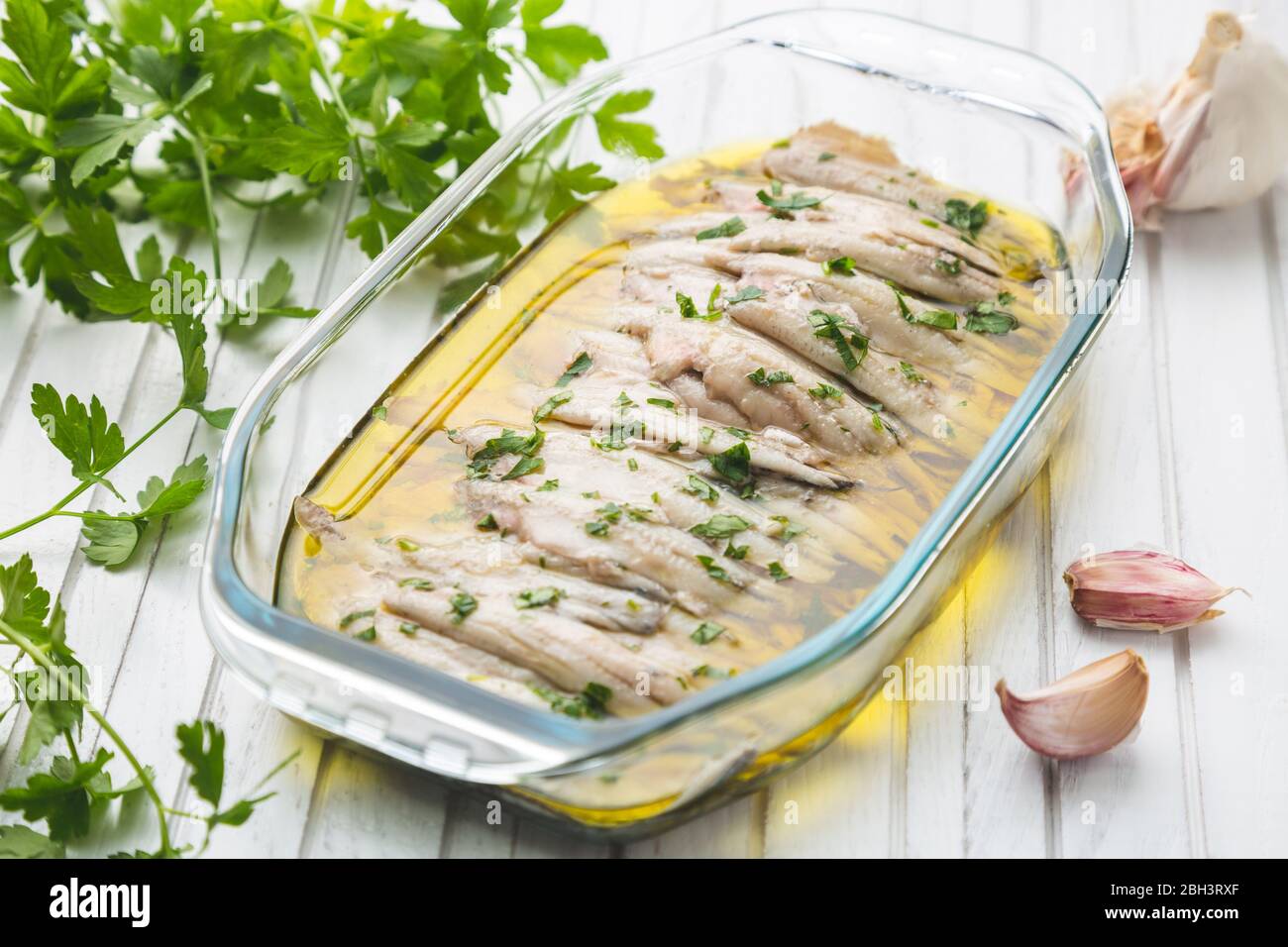 Marinated anchovies in vinegar with olive oil and parsley. Traditional