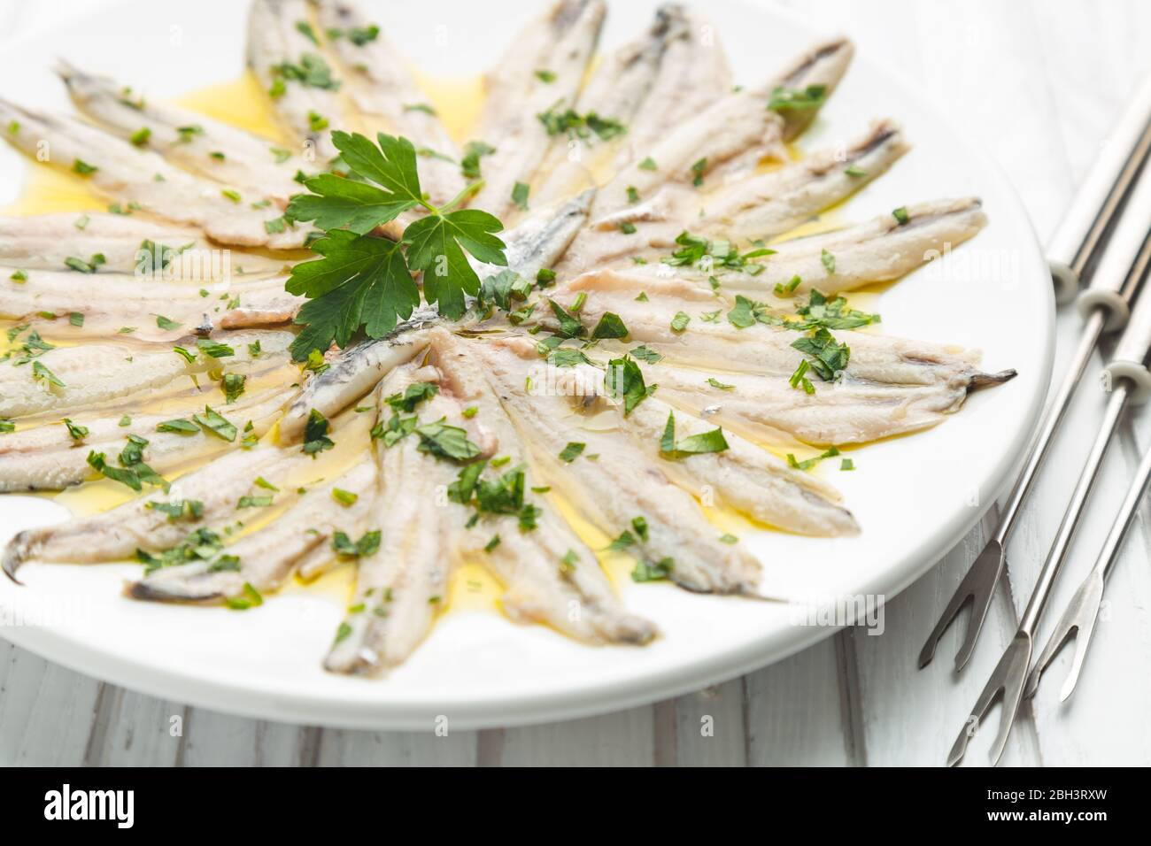 Marinated Anchovies In Vinegar With Olive Oil And Parsley Traditional Spanish Tapa Stock Photo Alamy