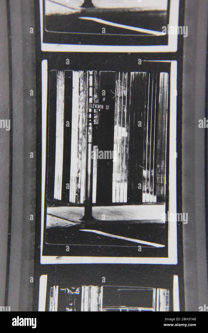Fine 70s vintage extreme high contrast contact print photography of a regular street corner at a downtown intersection. Stock Photo