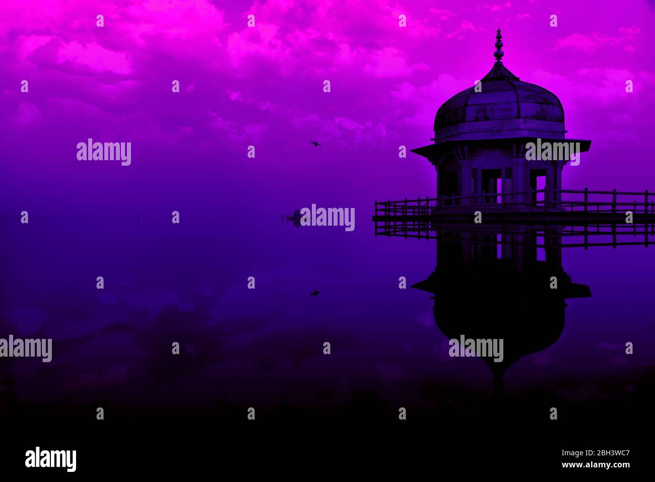 Digital manipulation conceptual image of Jasmine tower, in Agra fort, appearing partially submerged in water with a beautiful gradient evening sky. Stock Photo