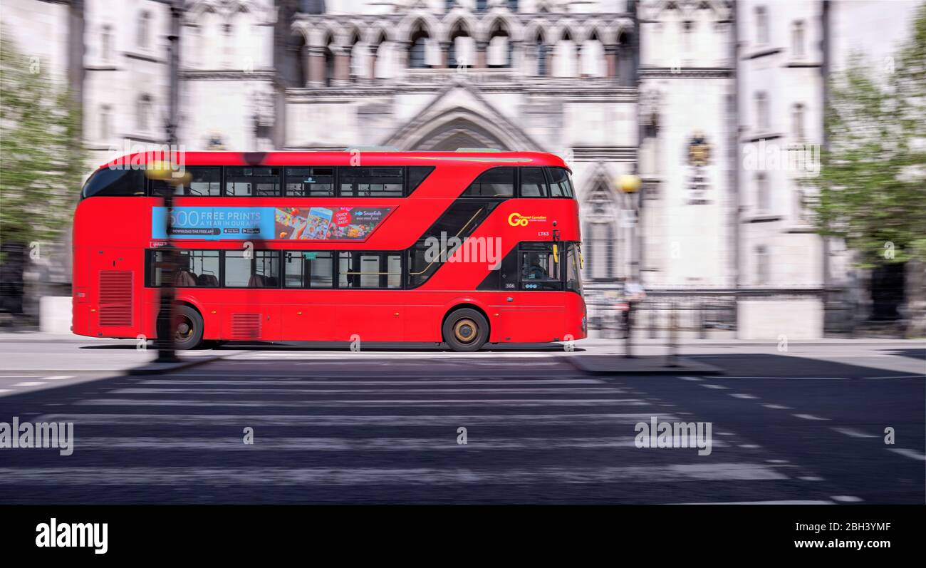 Transport for London Bus going pass Royal Court of Justice in Motion. Stock Photo