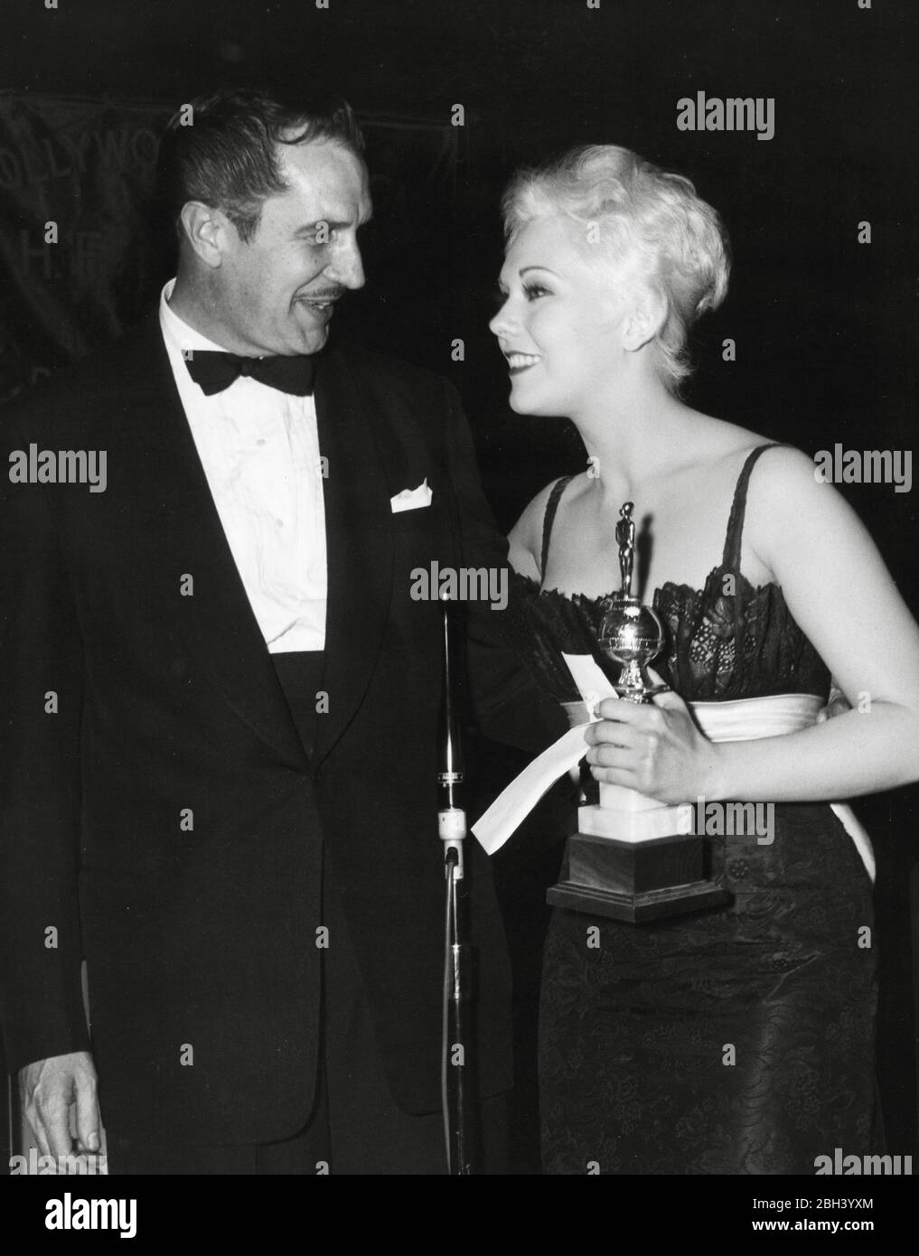 Kim Novak receives a special award as World Film Favorite, presented by Vincent Price, at the 14th Golden Globes, on Thursday, February 28, 1957, at the Cocoanut Grove, Ambassador Hotel.  File Reference # 33962-615THA Stock Photo