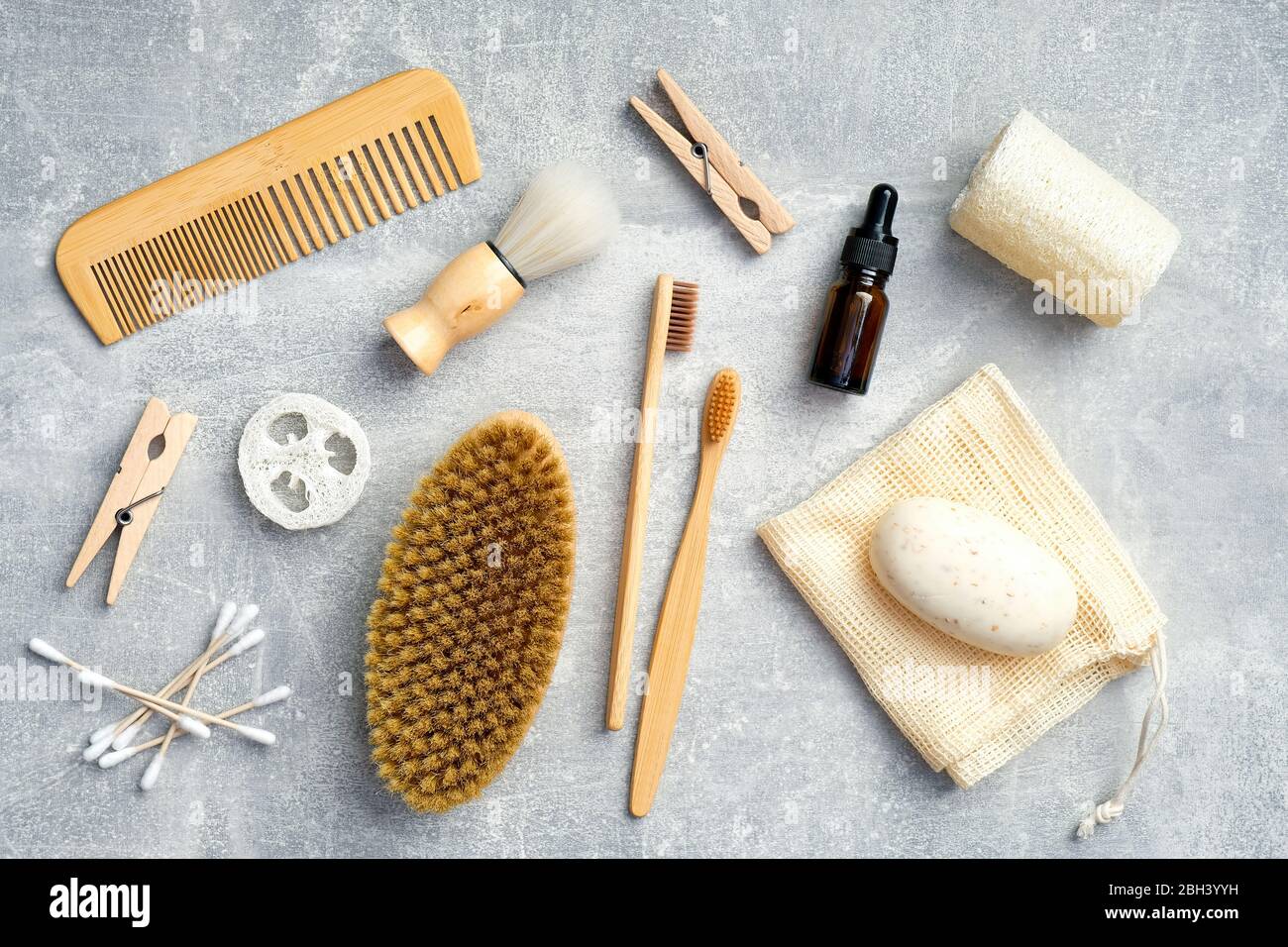Flat lay composition with bath cosmetics and accessories on stone table ...