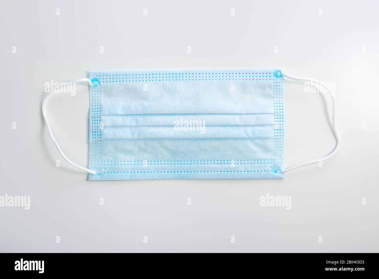 Corona protection medical mask on white background. Face mask protection against pollution, virus, flu. Stock Photo