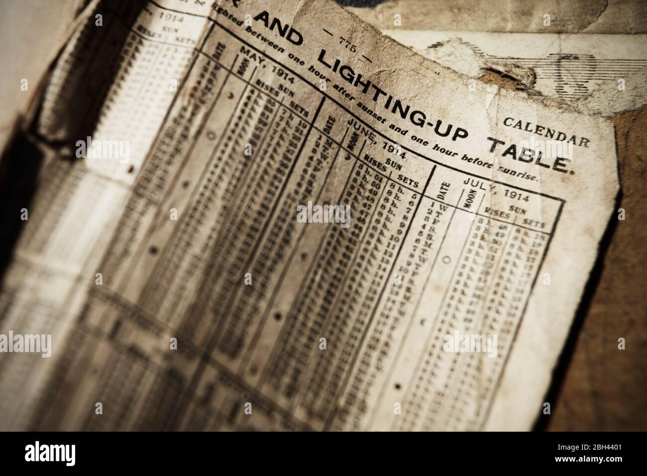 Lighting up times for 1914 in old book Stock Photo Alamy