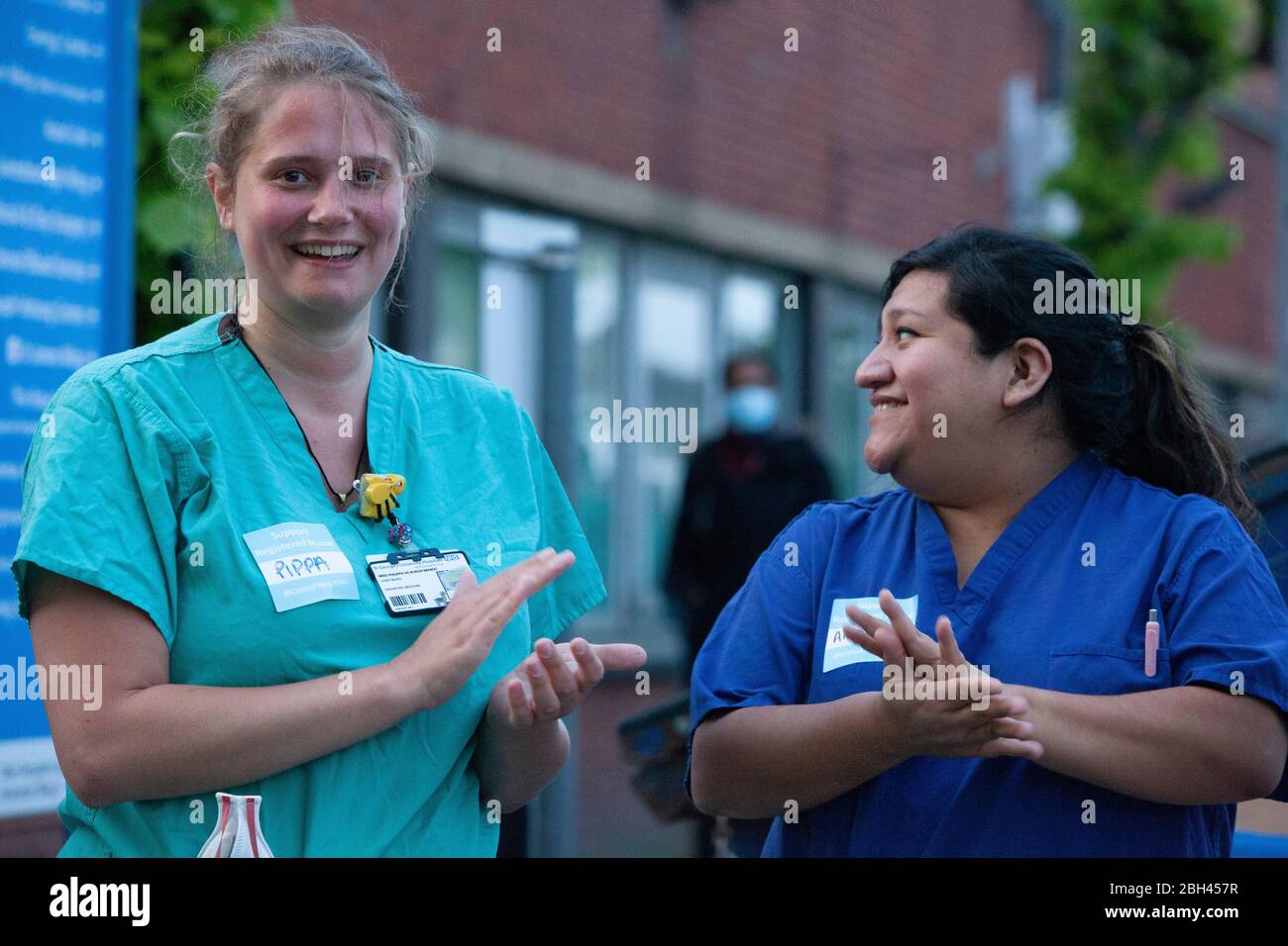 London, UK, 23 April 2020: medical and support staff gathered at the A&E ambulance bay at St George's Hospital, Tooting, to join Clap For Our Carers. Anna Watson/Alamy Live News Stock Photo