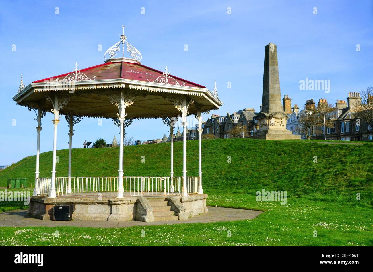 The old red roofed bandstand at St. Andrews with the martyrs monument behind. Stock Photo