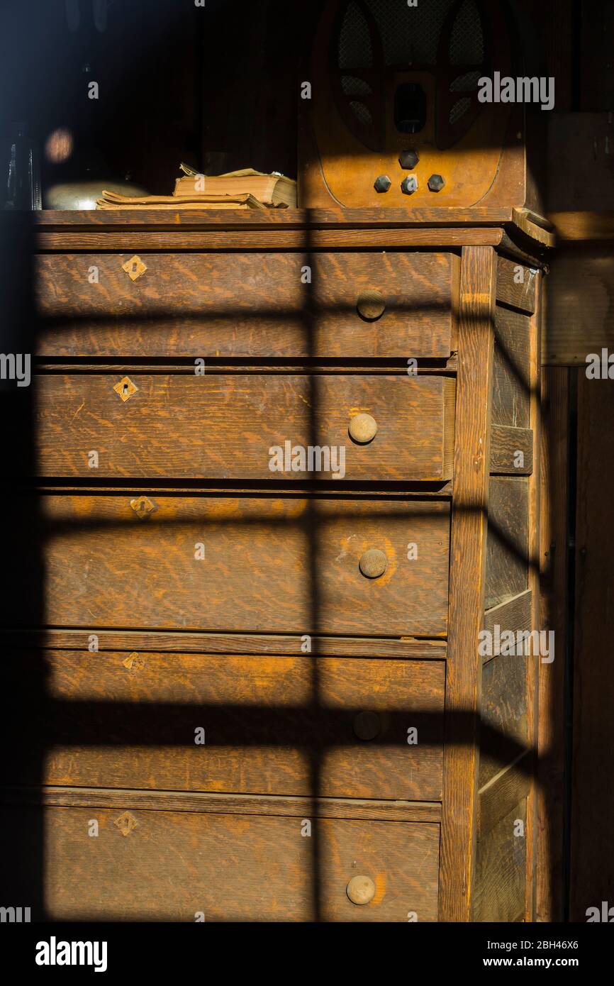 Old oak dresser in a house in the old silver and gold mining ghost town of Berlin in Berlin-Ichthyosaur State Park, Nevada, USA Stock Photo
