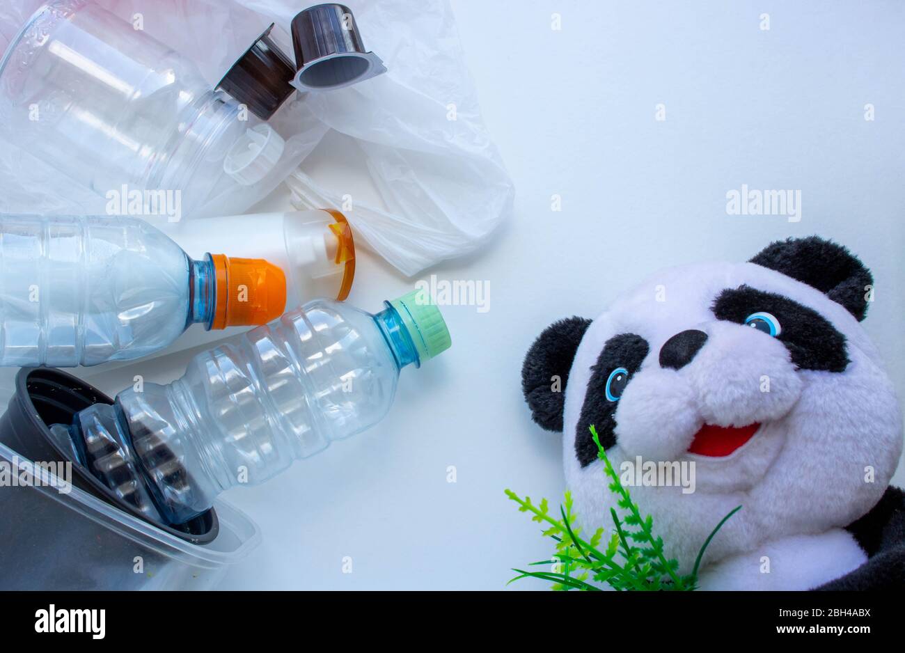 Plastic containers on a white background. The processing of plastics