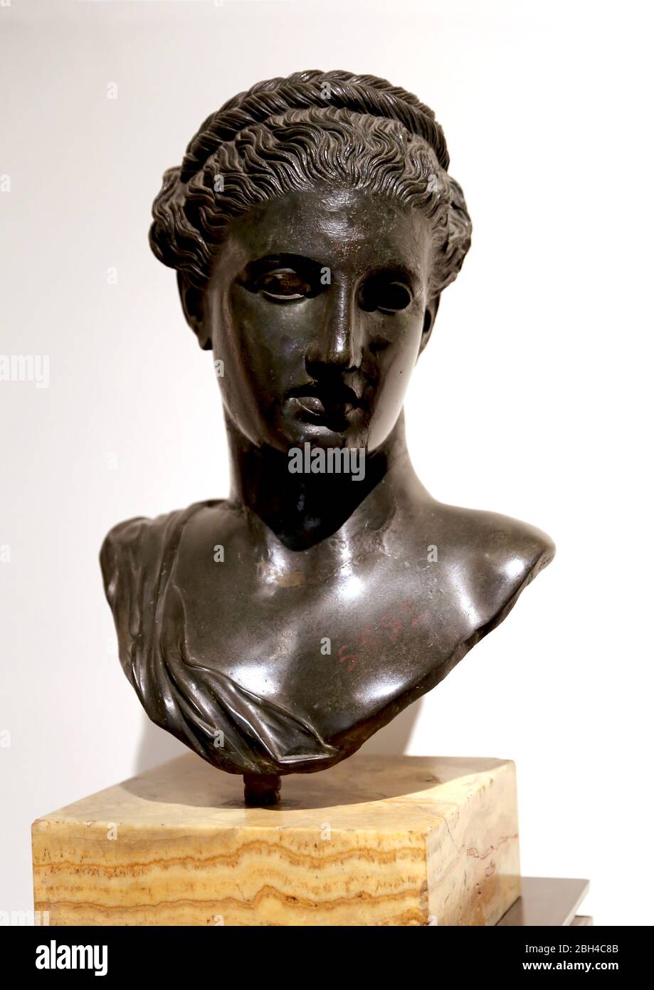 Bust of Berenice or Artemis, Roman bronze. 1st cent. BC. Villa of Papiry, Herculaneum. Archaeological Museum of Naples, Italy. Stock Photo