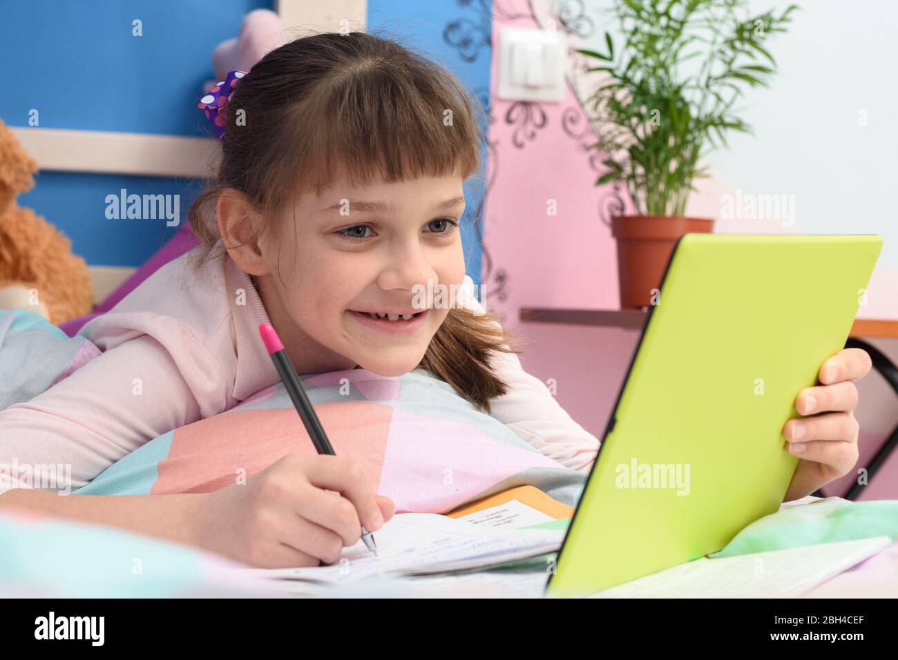 Happy girl studying online at home using distance learning Stock Photo ...