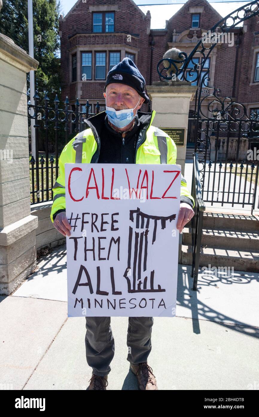 Protester standing in front of governors mansion calling for Governor Walz to free all prisoners during Covid-19 pandemic. St Paul Minnesota MN USA Stock Photo