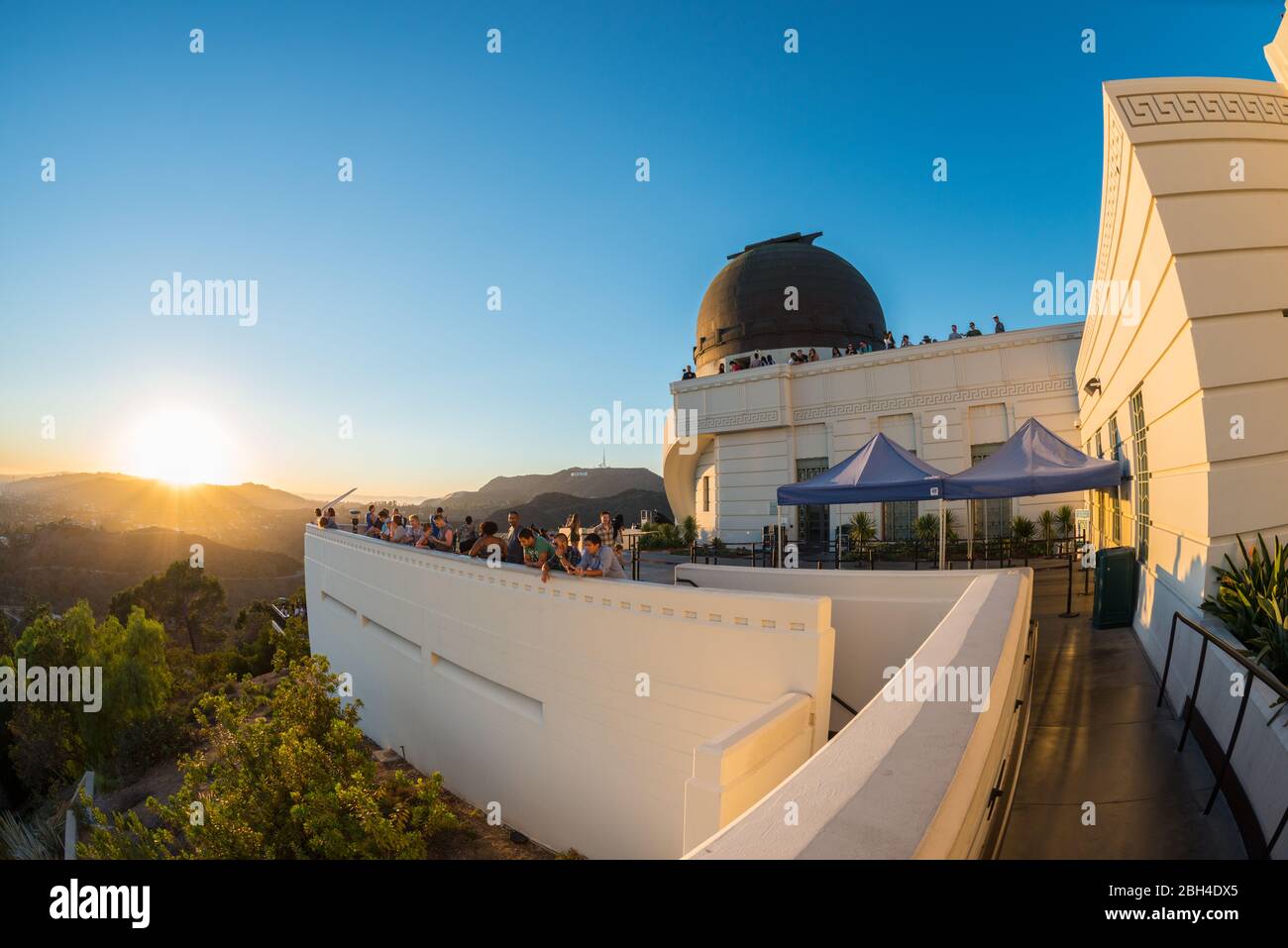 Los Angeles, California, USA. 19th September 2018. People watching sunset from the top of Griffith Observatory. Clear sky, white bulding and dome Stock Photo