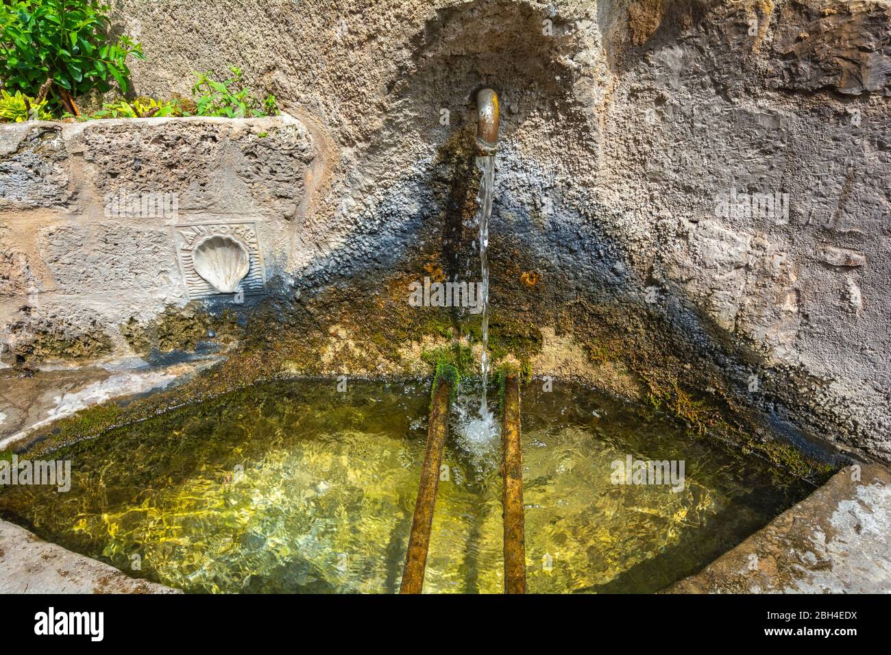 France, Saint-Guilhem-le-Desert, sign marks a potable water fountain on the route of St. James (Jacques) to Santiago de Compostella (Compostelle) Stock Photo