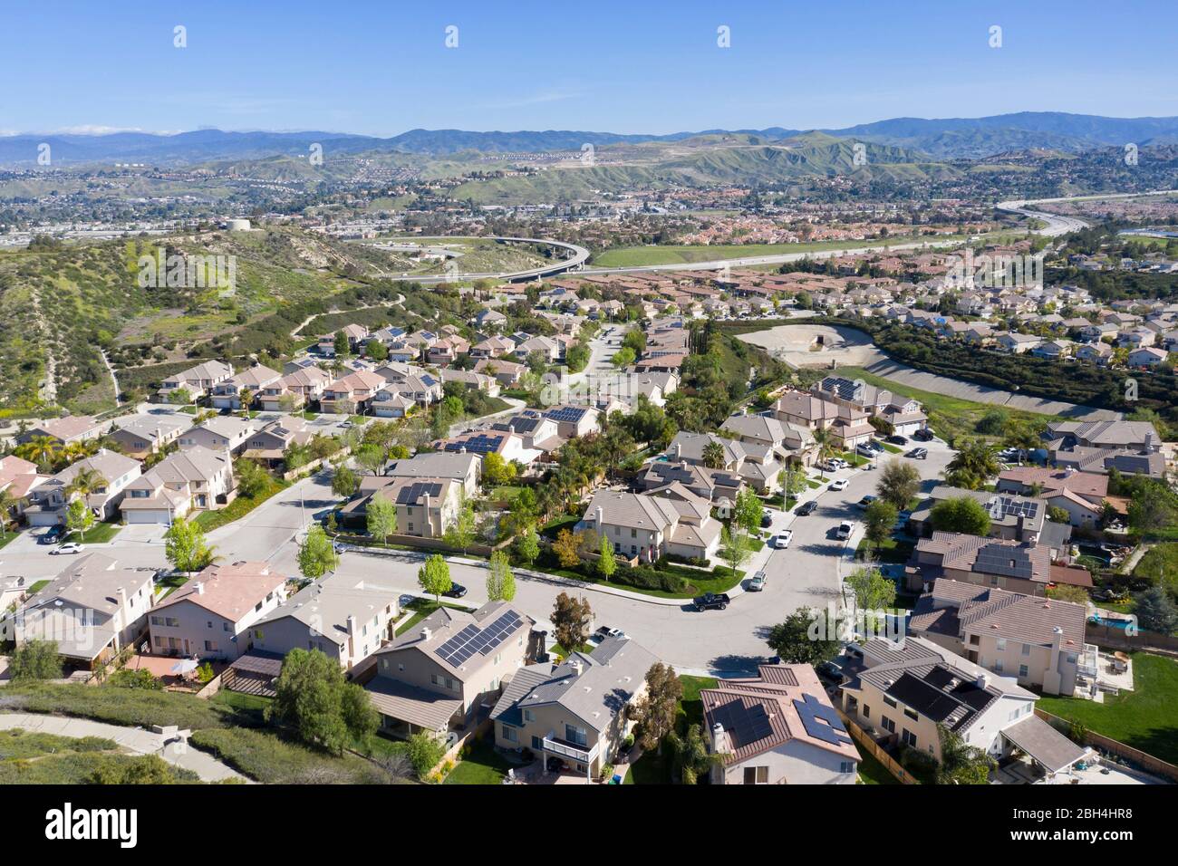 Aerial view above Canyon Country sprawl rows of homes north of Los Angeles in Santa Clarita, California Stock Photo