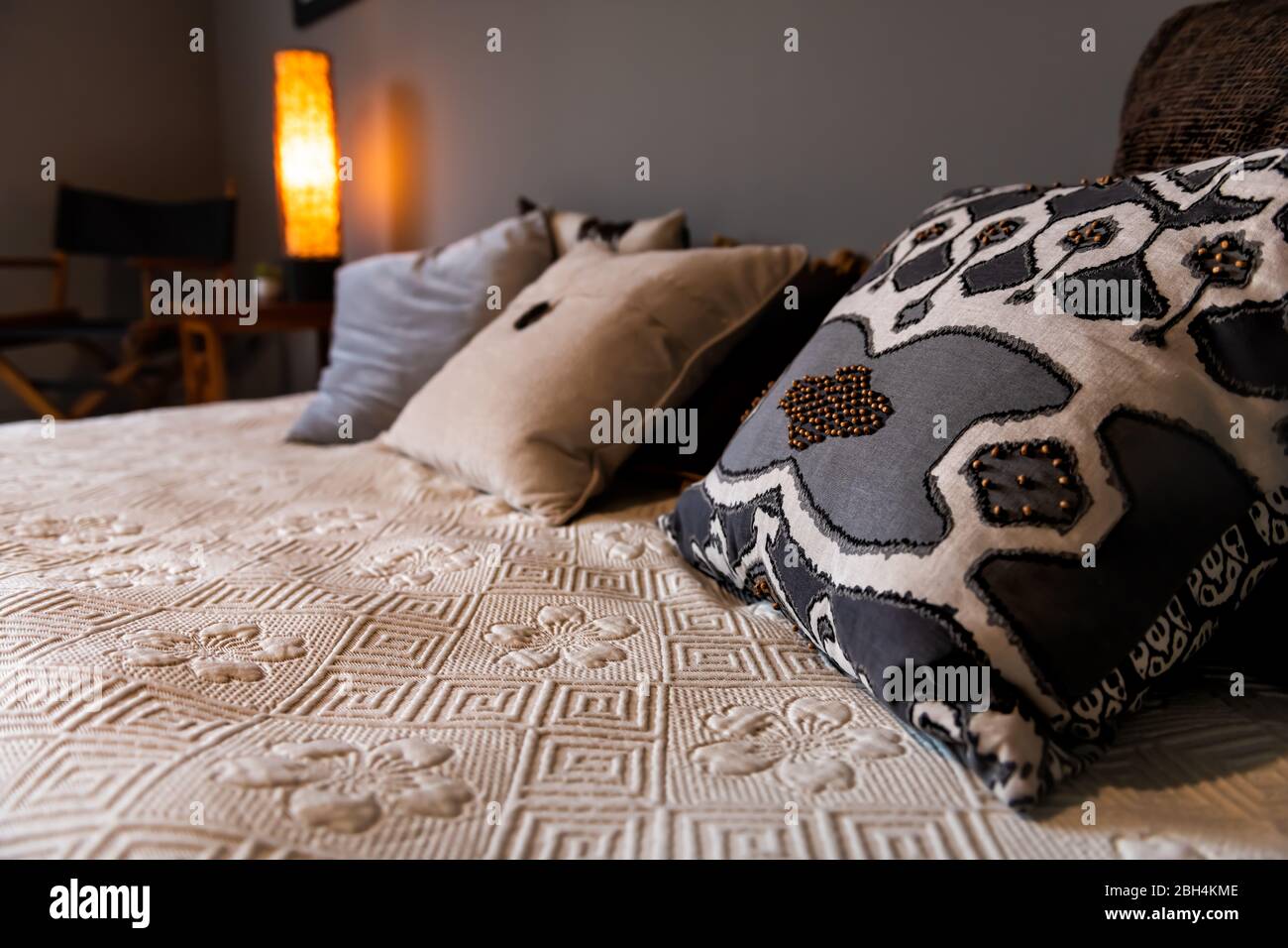 Closeup Of New Bed Comforter With Decorative Pillows Headboard In Bedroom  In Staging Model Home House Or Apartment Stock Photo - Download Image Now -  iStock