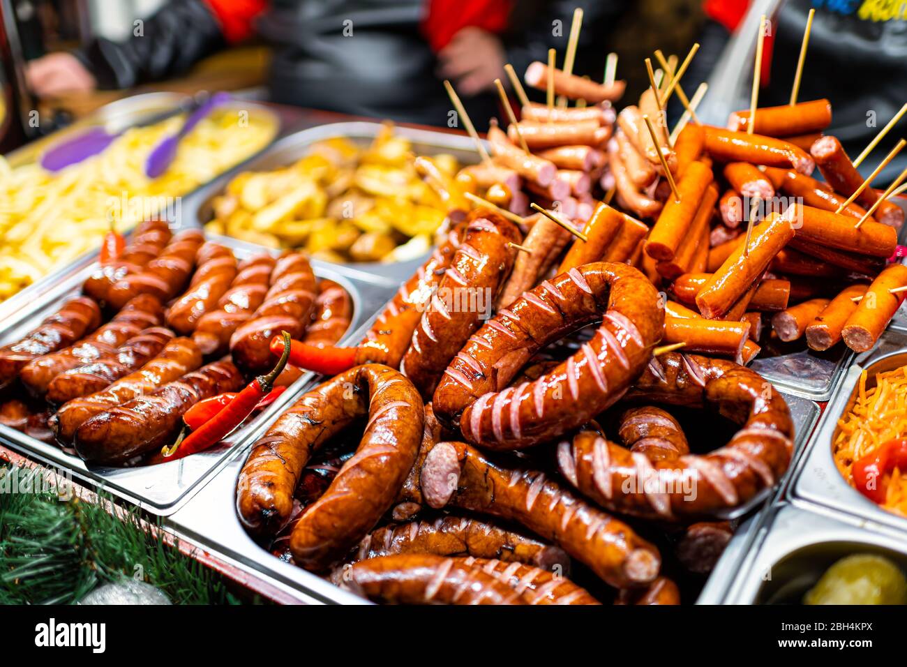 Lviv, Ukraine Christmas winter market food buffet fast restaurant table display with traditional salami smoked sausages meat in trays Stock Photo