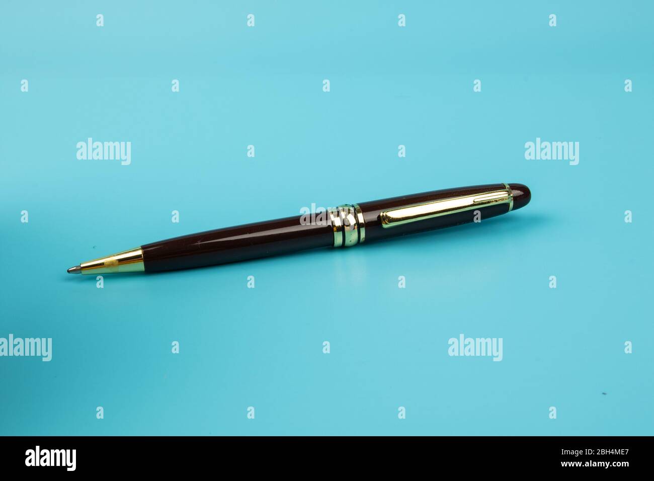 A ball pen on Blue background. Stock Photo