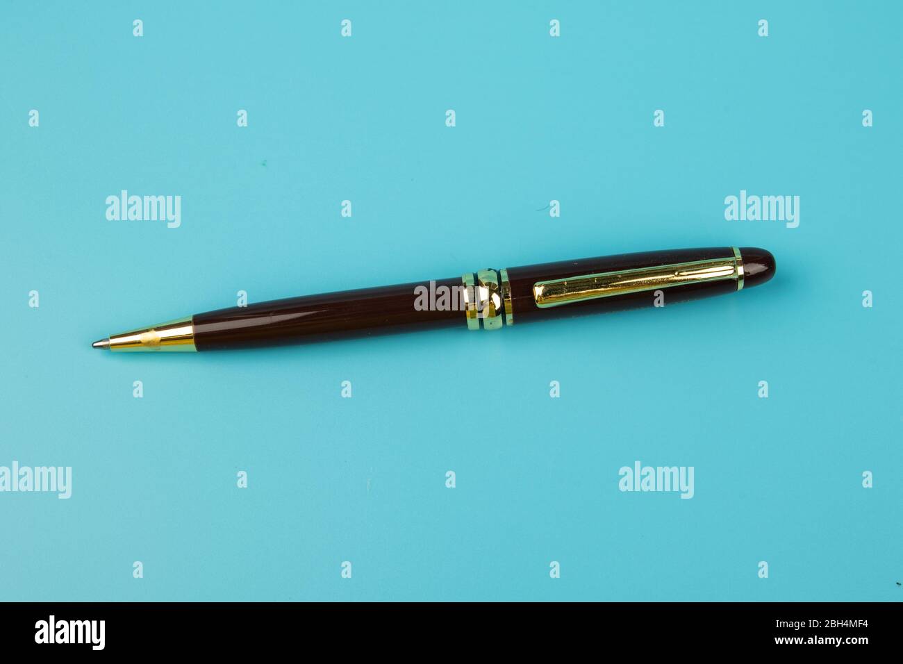 A ball pen on Blue background. Stock Photo