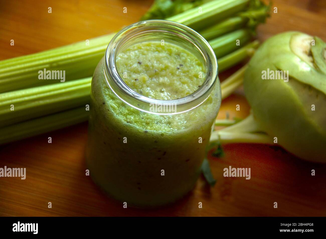 Green detox juice in glass jar. Healthy eating concept. Vegetable and fruit smoothie. Stock Photo