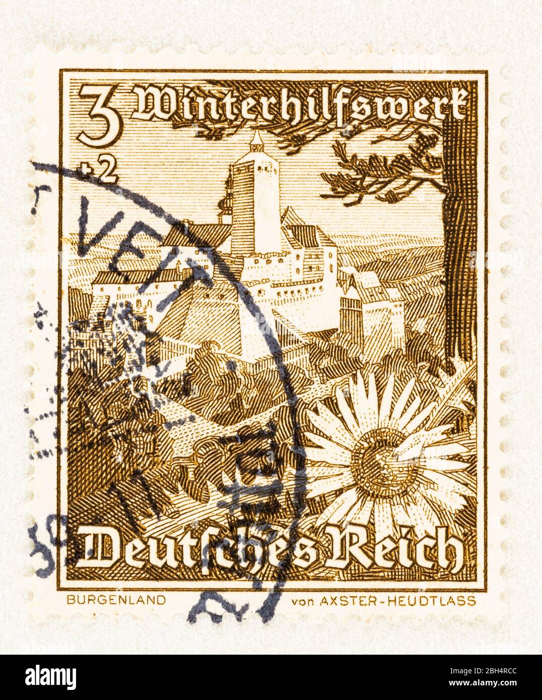 SEATTLE WASHINGTON - April 21, 2020: 1938 Winter Relief postage stamp of German Reich, featuring thistle flower and Forchtenstein Castle. Scott # B123 Stock Photo