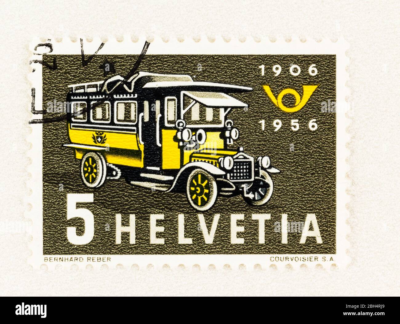 SEATTLE WASHINGTON - April 18, 2020: 1956 Swiss stamp commemorating 50th anniversary of Postal Bus service, featuring first bus of 1906 and posthorn Stock Photo