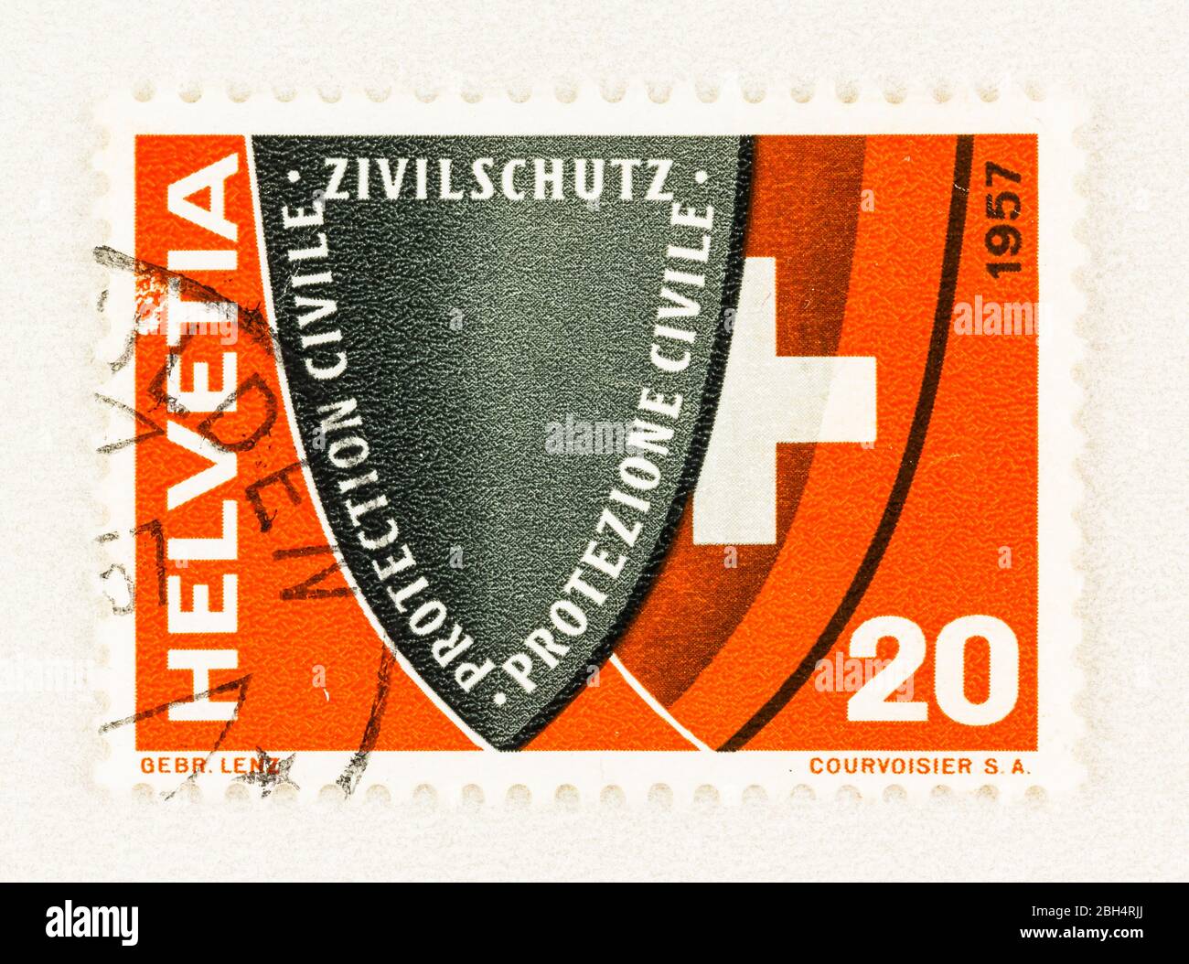 SEATTLE WASHINGTON - April 18, 2020: 1957  Swiss postage stamp publicizing Swiss Civil Defense, featuring shields with inscription and national Coat o Stock Photo