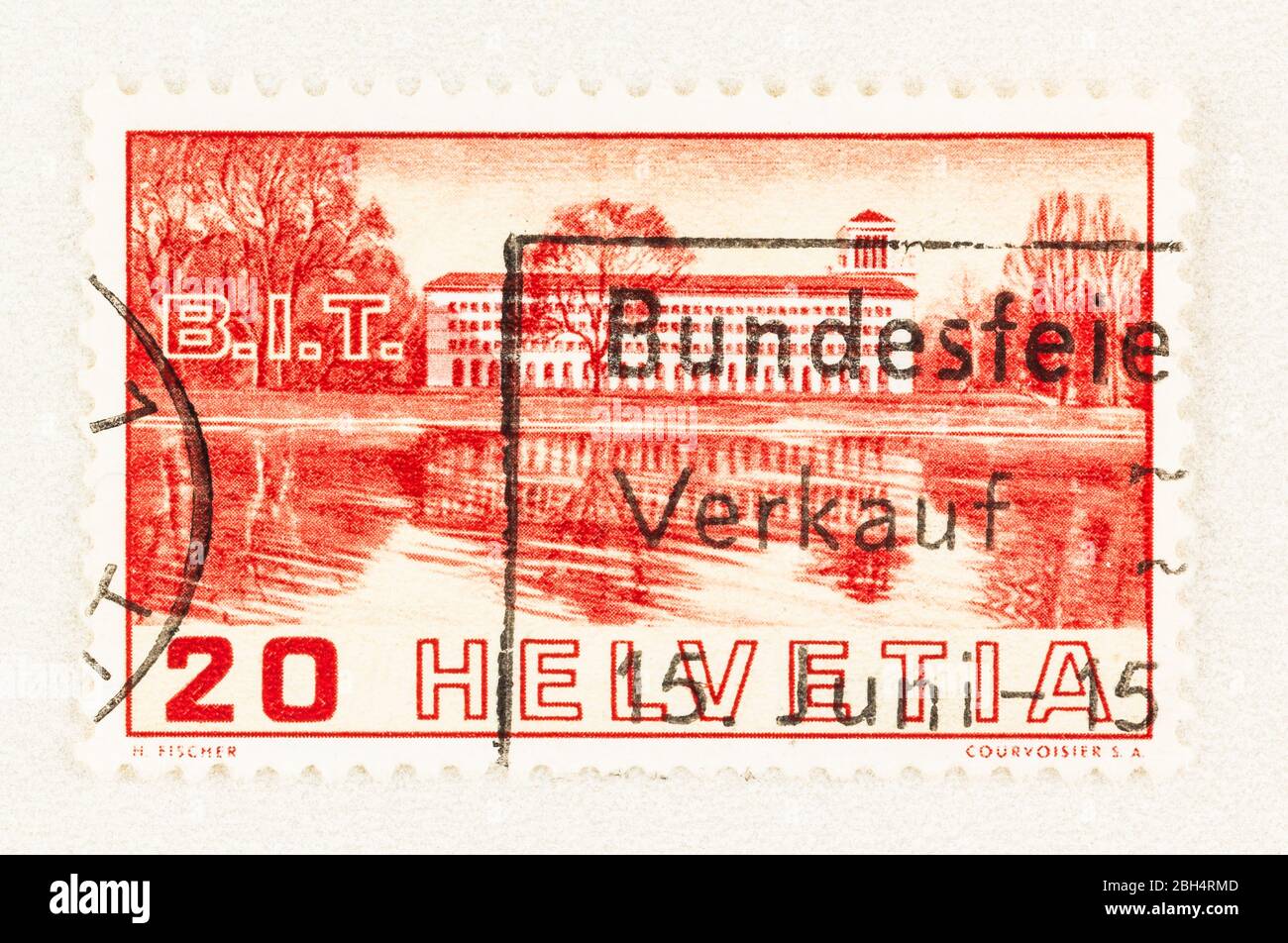 SEATTLE WASHINGTON - April 18, 2020: 1938 Swiss postage stamp with view of International Labor Bureau building across Lake Geneva.  Scott # 238. Stock Photo