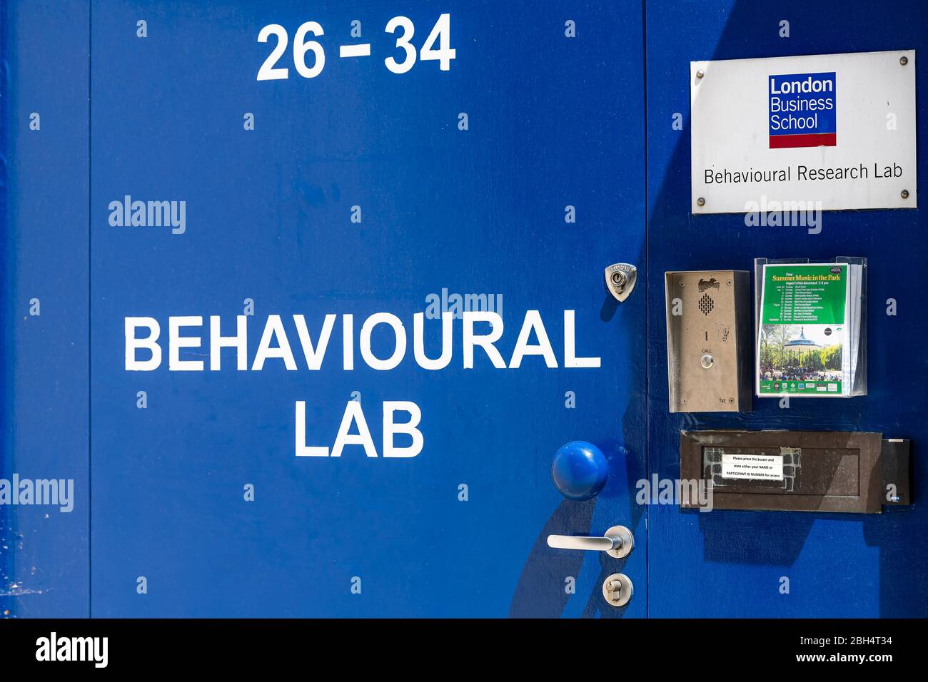 London, UK - June 24, 2018: Street road and University London Business School blue sign closeup and entrance to college Behavioural lab Stock Photo