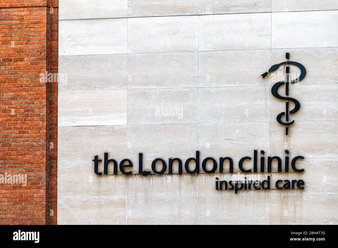 London, UK - June 24, 2018: Building exterior and sign closeup in Marylebone modern architecture for London clinic inspired care hospital logo Stock Photo
