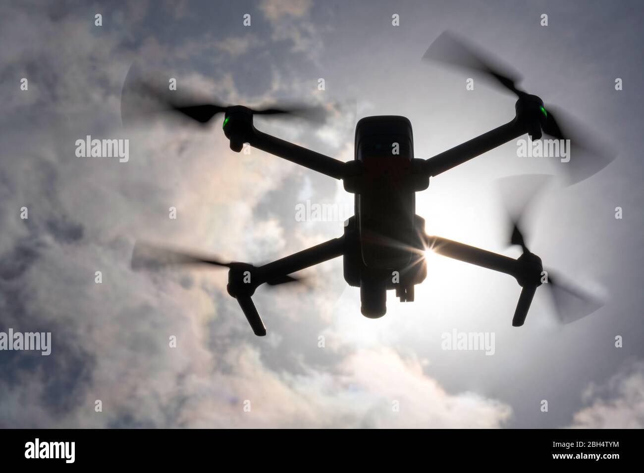 Drone flying in sky Stock Photo