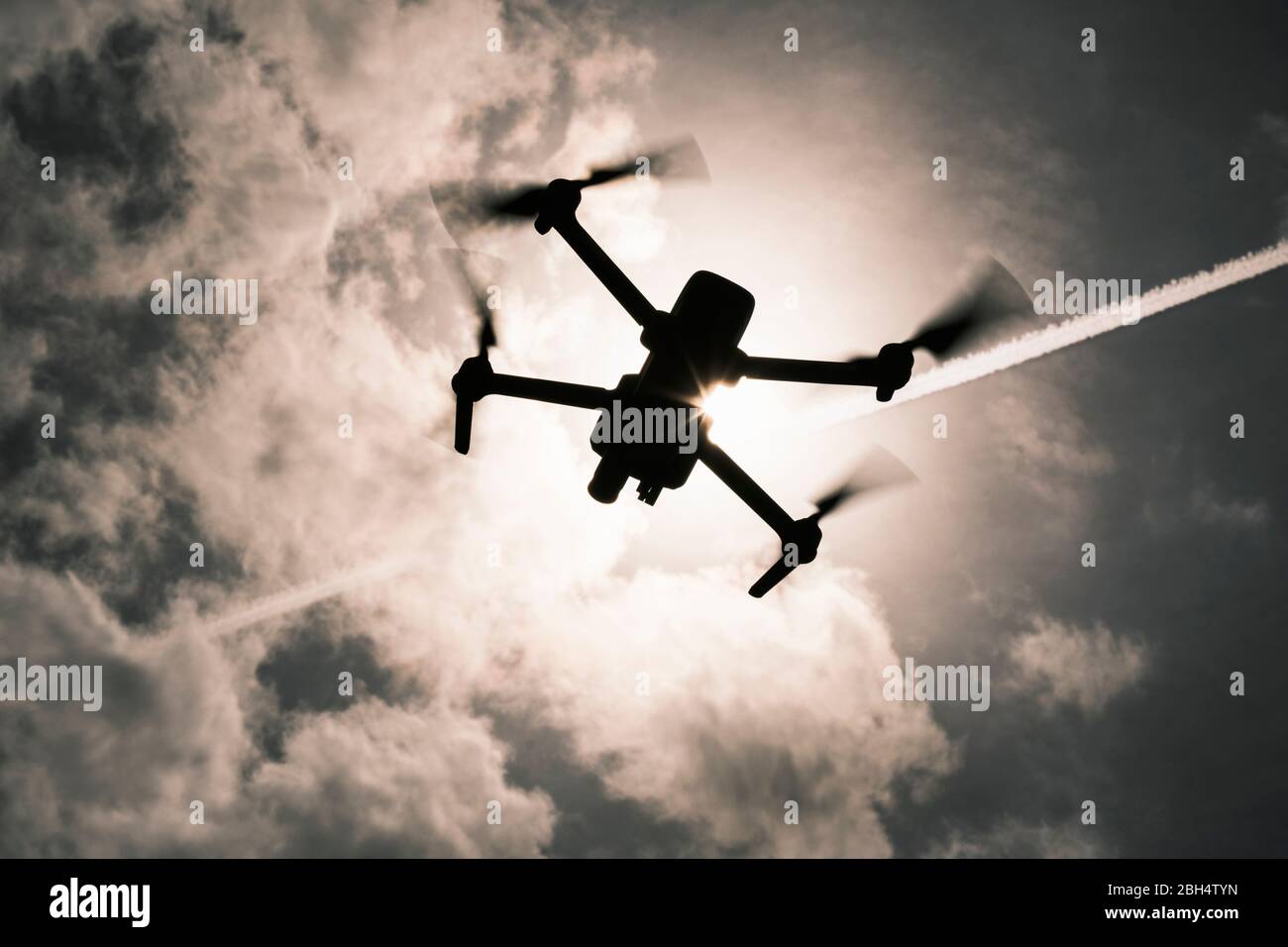 Drone flying in sky Stock Photo