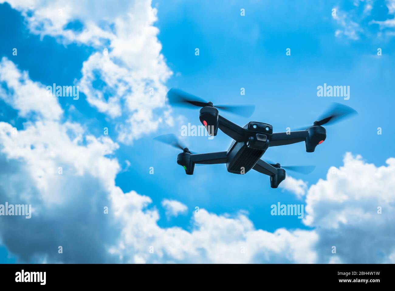 Drone flying in sky Stock Photo