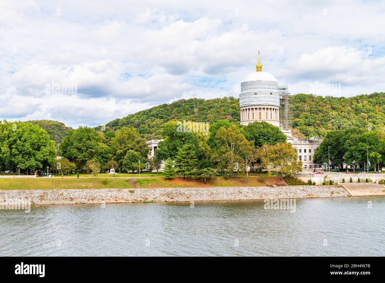Charleston, USA - October 17, 2019: Autumn in West Virginia capital city with Kanawha river and construction on state capitol landscape view and cloud Stock Photo