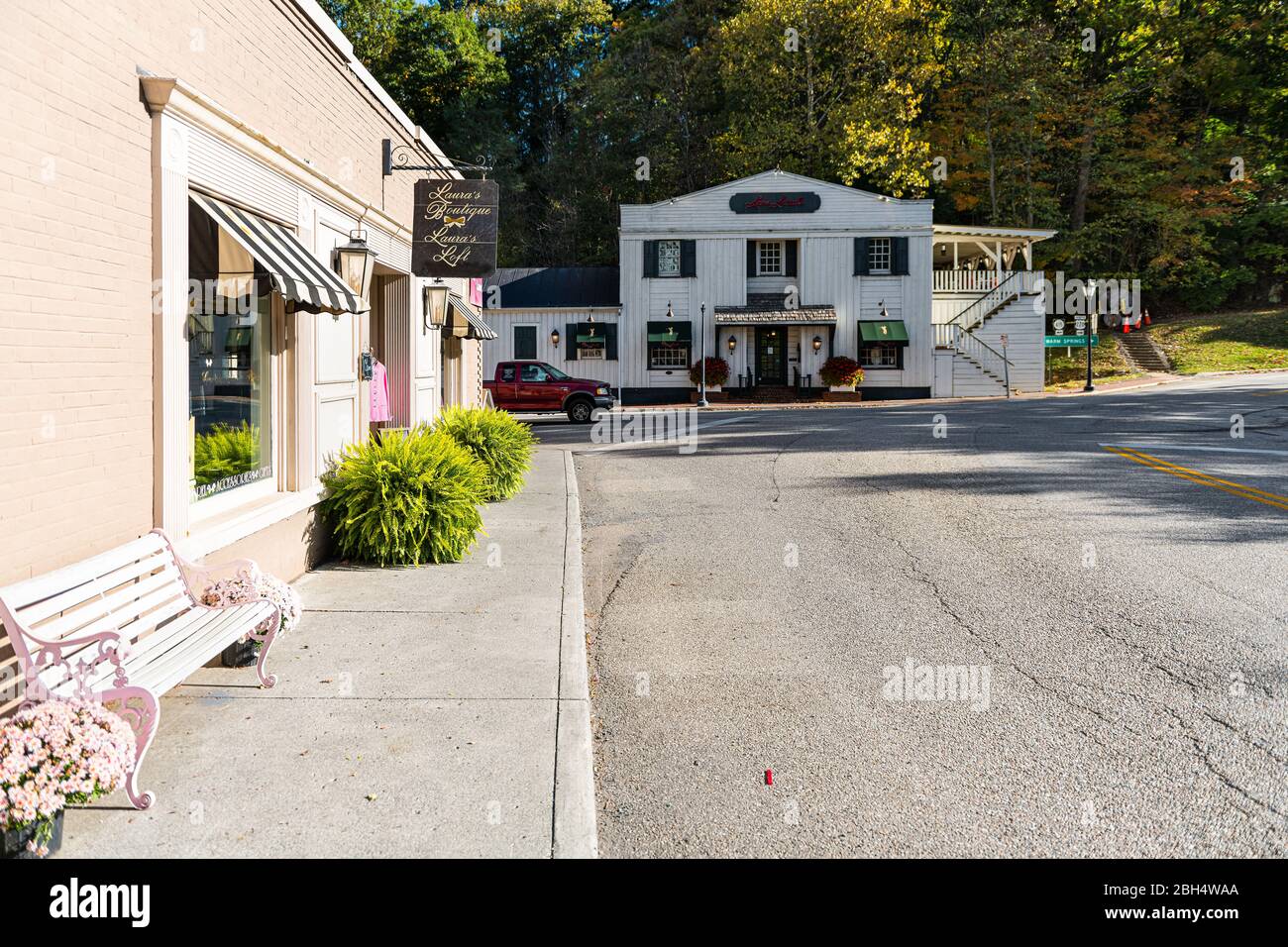 Hot Springs, USA - October 18, 2019: Historic downtown town empty street road in village city in Virginia countryside with old building architecture a Stock Photo