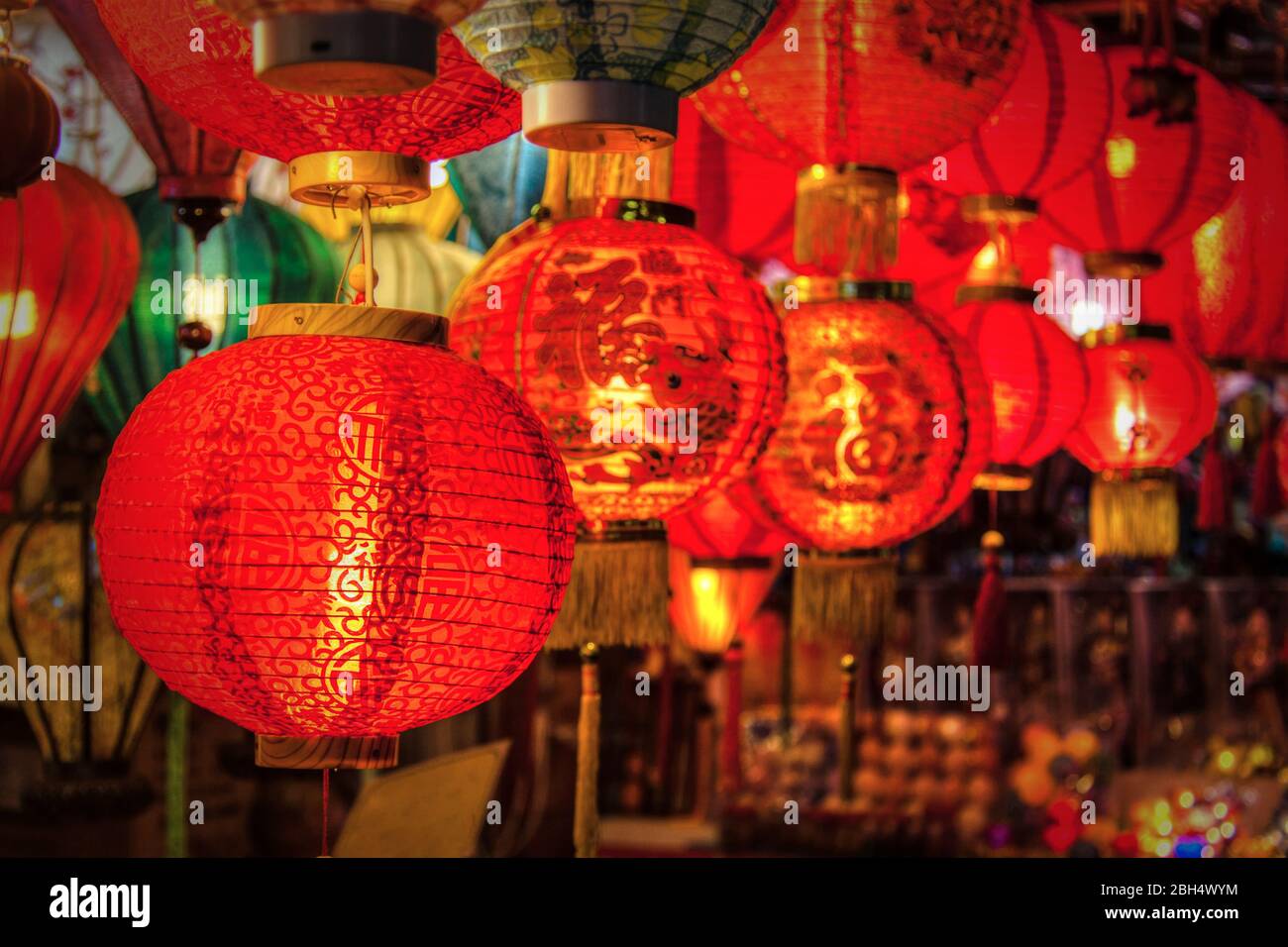 Red Chinese New Year lanterns on sale in Singapore Chinatown. These typical paper lanterns are good luck symbols, as illustrated by the Chinese charac Stock Photo