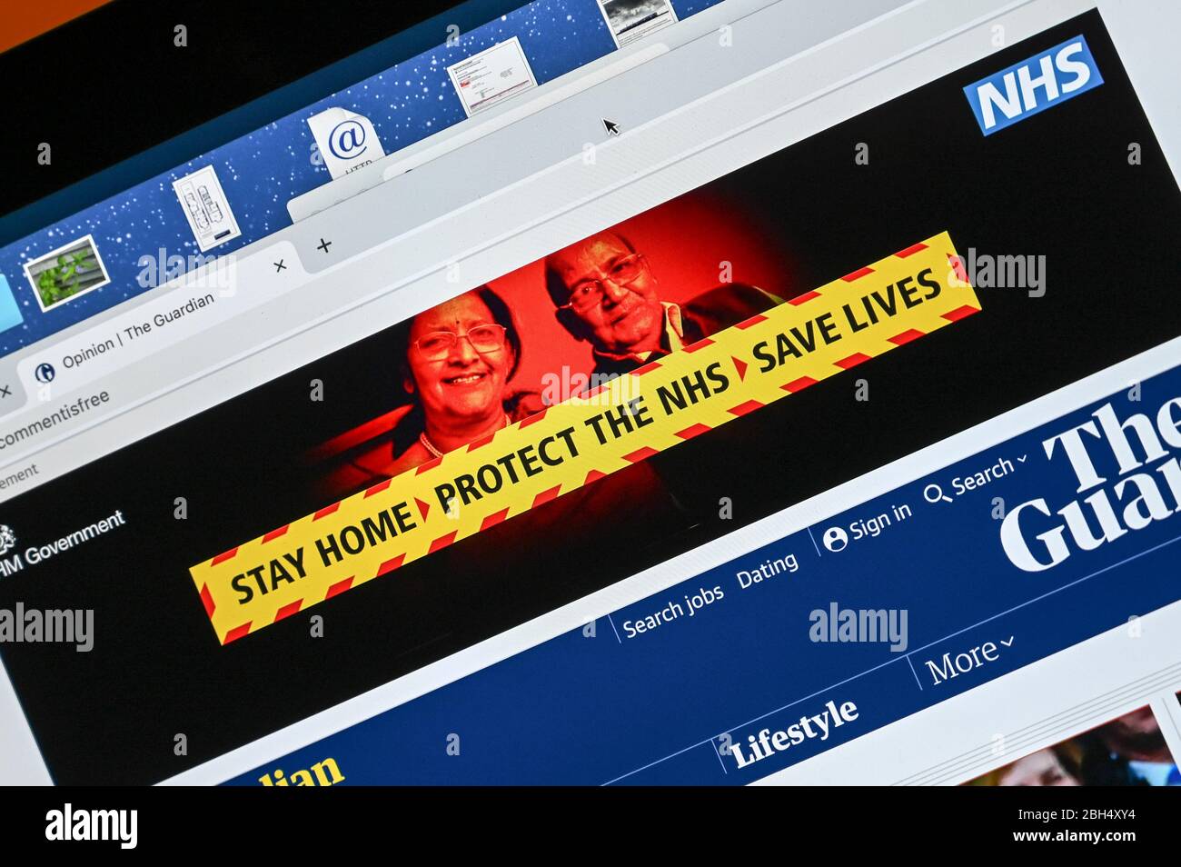 UK Government Covid public information advert placed on on-line newspaper with caption 'stay home - protect the NHS - save lives'. Stock Photo
