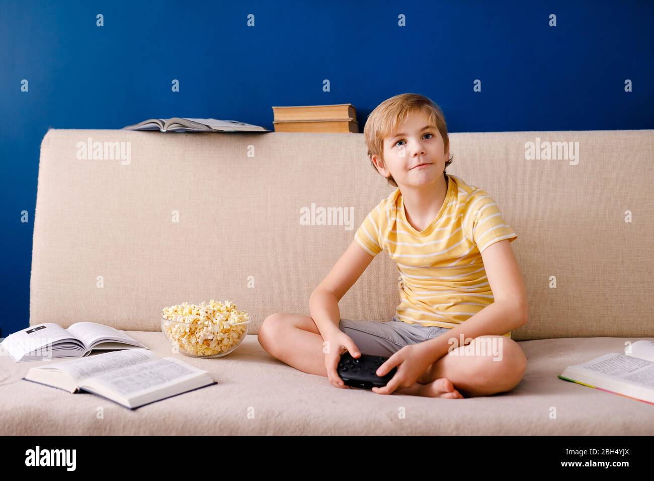 Young girl playing video games on computer after online school and  homework. Gamer using shooting action play for entertainment and fun with  keyboard and monitor. Child enjoying game Stock Photo - Alamy