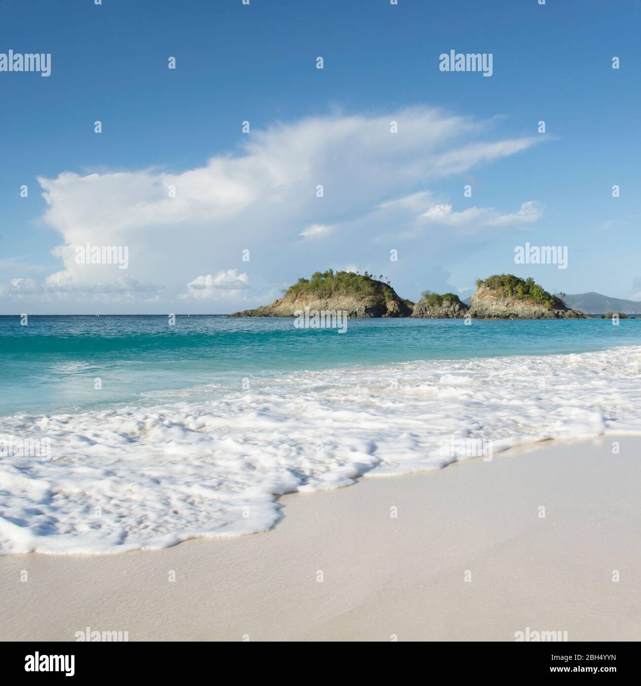 Beach with cliff in distance at Trunk Bay in St. John, Virgin Islands Stock Photo