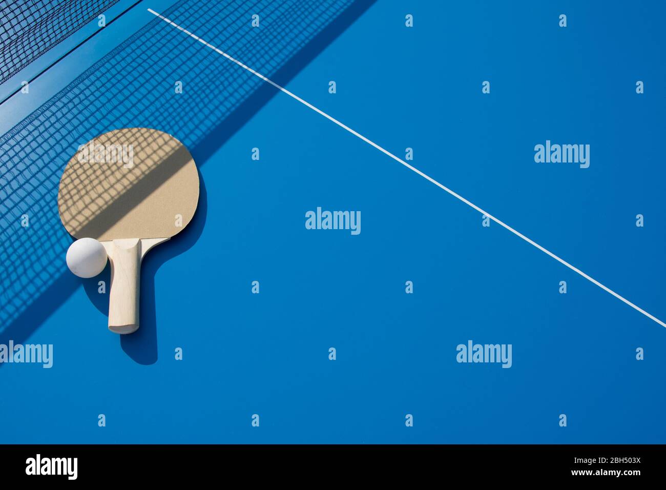 Table tennis paddle and ball Stock Photo