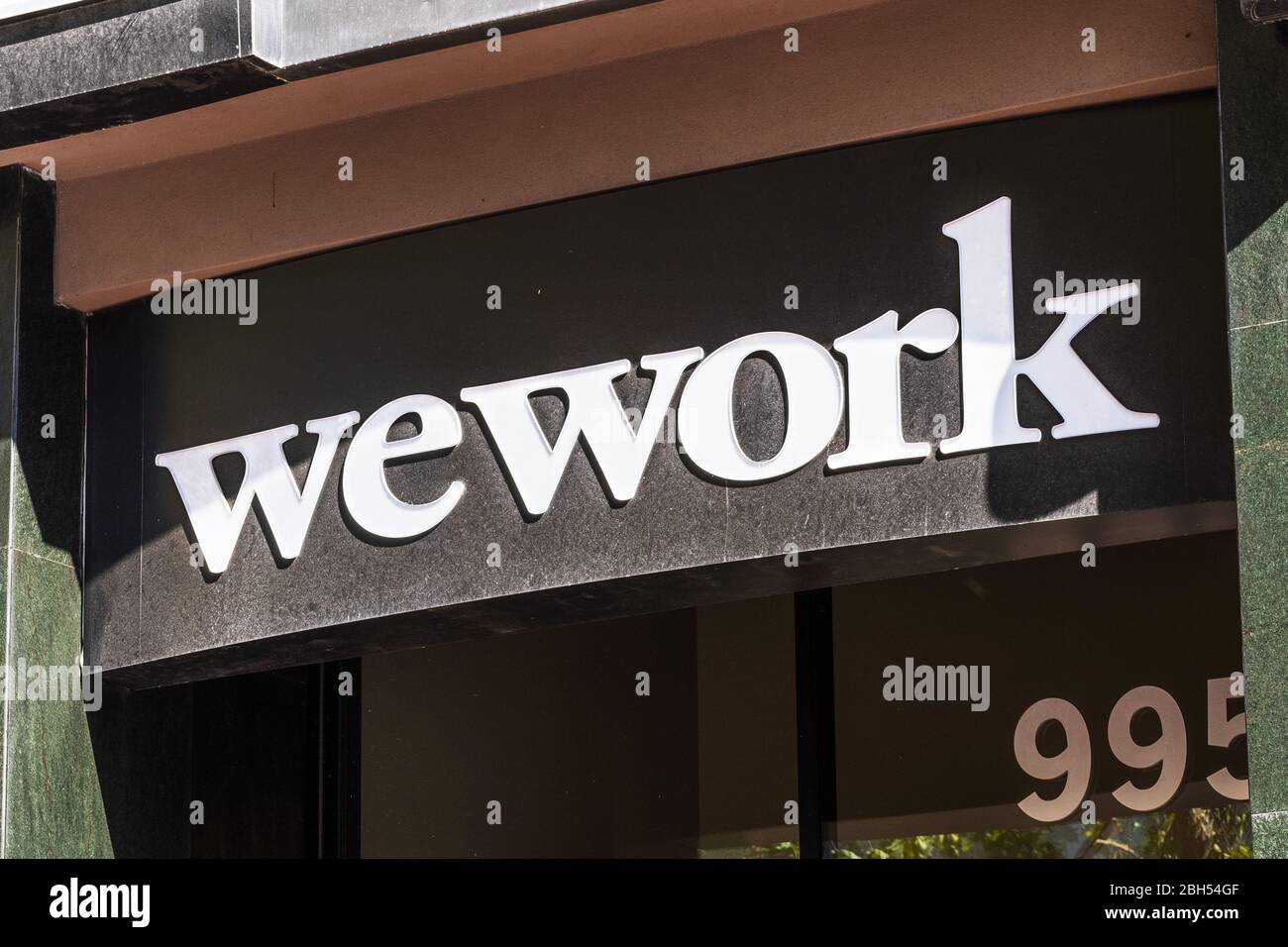 August 21, 2019 San Francisco / CA / USA - WeWork logo at one of their office buildings; WeWork is an American company that provides shared work space Stock Photo