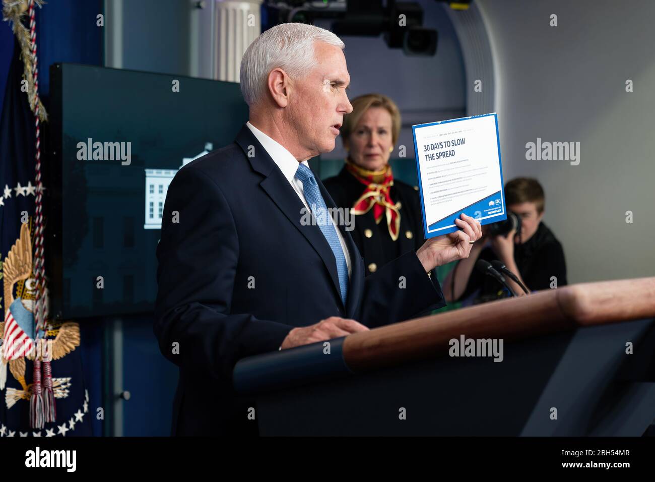 White House Coronavirus Update Briefing President Donald J. Trump listens as Vice President Mike Pence delivers remarks at a coronavirus update briefing Tuesday, March 31, 2020, in the James S. Brady Press Briefing Room of the White House. Stock Photo