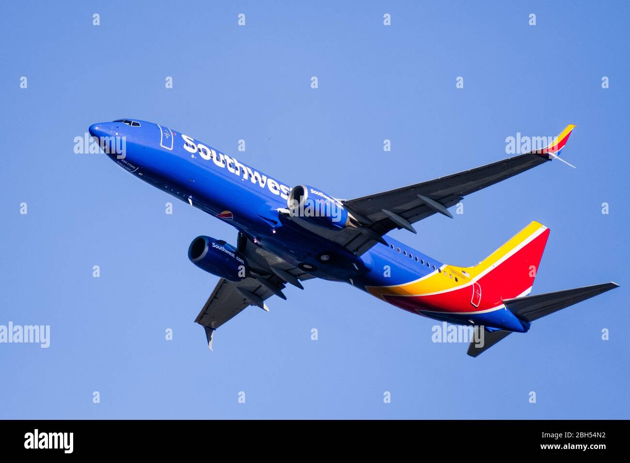 Mar 4, San Jose / CA / USA - Close up of Southwest Airlines aircraft in flight; the Southwest Airlines Heart logo visible on the airplane underbelly; Stock Photo