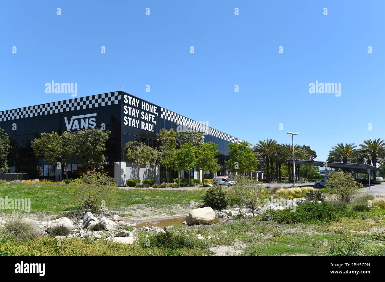 COSTA MESA, CALIFORNIA - 23 APRIL 2020: Vans “Off the Wall” Headquarters, a  shoe and apparel company, with Stay Home, Stay Safe, Stay Rad sign on the  Stock Photo - Alamy