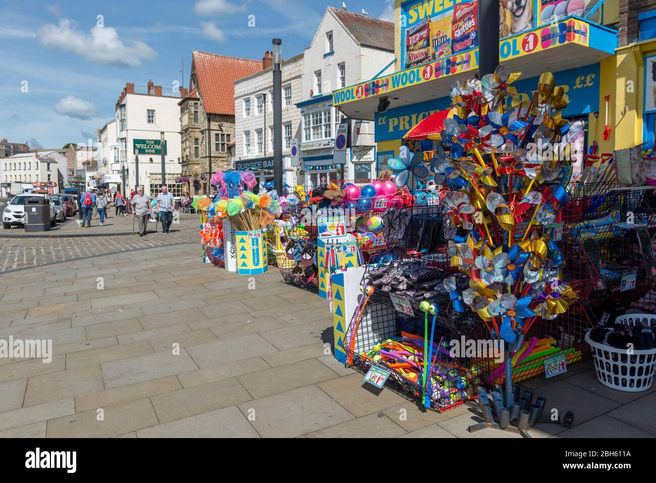 Display outside a shop selling colourful beach goods on Sandside, near the harbour in Scarbrough, North Yorkshire Stock Photo